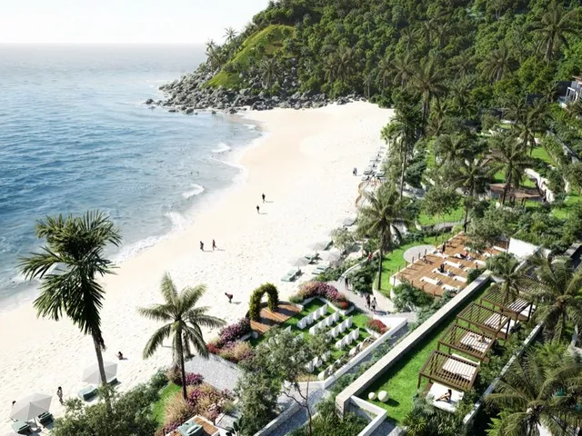 An aerial render of The One Lombok: a white-sand beach curving to a rocky, forested headland, with palm-lined gardens, pergola day beds and white villas stepping up the hillside beside it.