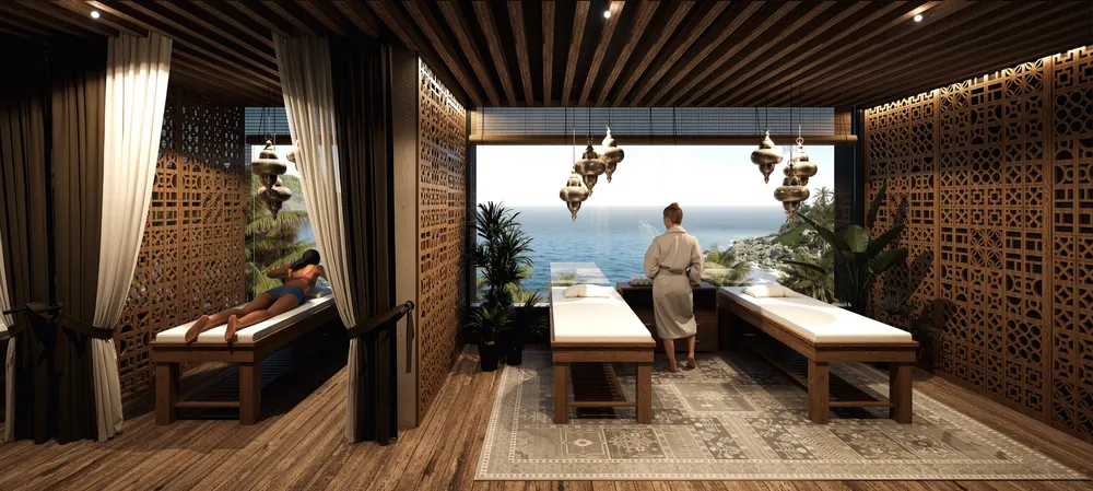 A render of the spa: three massage beds between carved timber screens and curtains, open to the sea.